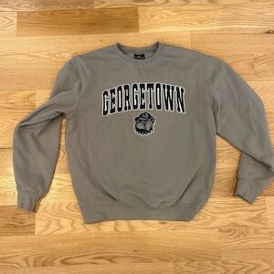 Georgetown Hoyas Colosseum Arch & Logo Crew Neck Sweatshirt - Gray Size Medium.